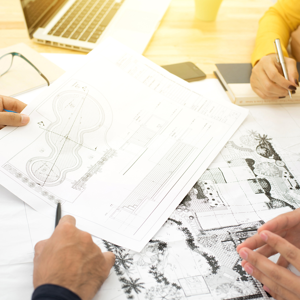 Services-Landscape-Design A landscape designer works to draft plans with their clients