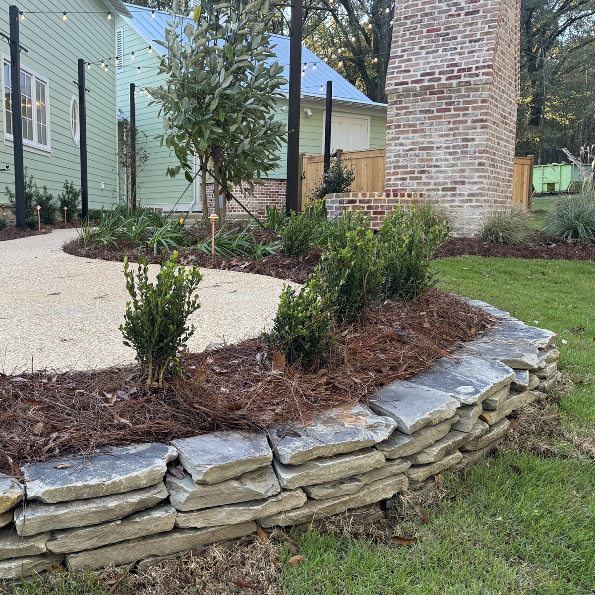 hardscape A photo of a low wall made of stacked stones